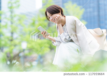 Middle-aged business woman working in an office district 117059664