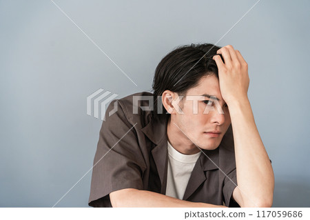 Male model sitting at a desk (ennui, fashionable, narcissist) Male model sitting at a desk (ennui, fashionable, narcissist) 117059686