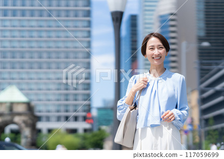 Middle-aged business woman working in an office district 117059699