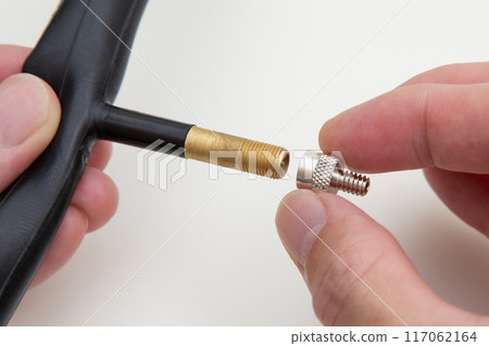 Bicycle valve conversion adapter: Converts from American to British valves 117062164