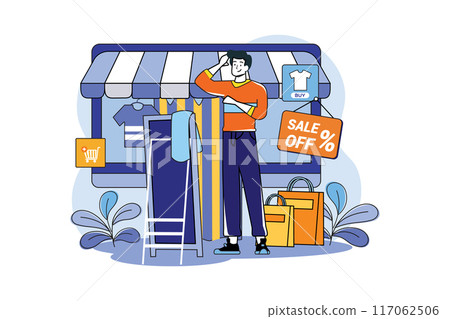 Guy fitting clothes in a dressing room at a fashion online shop Guy fitting clothes in a dressing room at a fashion online shop 117062506