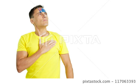 Man listening to the Australia national anthem with solemnity Man listening to the Australia national anthem with solemnity 117063393