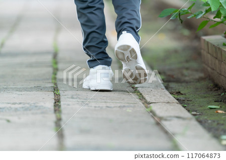 Senior man walking at his feet 117064873