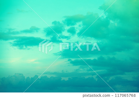 Cloudy sky at sunset. Colored green Cloudy sky at sunset. Colored green 117065768
