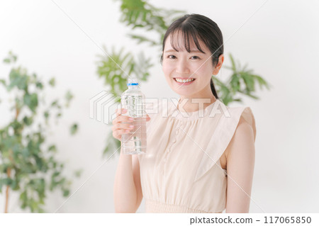 A woman with a bottle of water A woman with a bottle of water 117065850