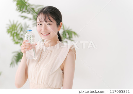 A woman with a bottle of water A woman with a bottle of water 117065851