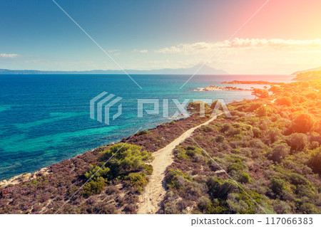 Seascape on a sunny day, view from above. Rocky beach with beautiful bays. Vourvourou Greece Europe Seascape on a sunny day, view from above. Rocky beach with beautiful bays. Vourvourou Greece Europe 117066383
