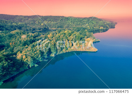 Seascape in the early autumn morning. View of seashore with colorful trees. Aerial view 117066475