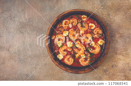 saganaki with shrimp, in a clay pan, Greek dish, shrimp in tomato sauce, feta cheese, homemade, no people, 117068541