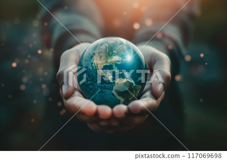 Earth at night was holding in human hands. Earth day. Earth at night was holding in human hands. Earth day. 117069698