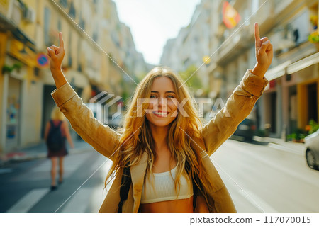 Young female tourist enjoys the view of the city. Europe travel. Young female tourist enjoys the view of the city. Europe travel. 117070015