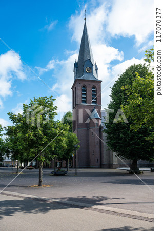 Gemert, North Brabant, The Netherlands, July 11, 2024 - Catholic Saint John Baptist church of the village center Gemert, North Brabant, The Netherlands, July 11, 2024 - Catholic Saint John Baptist church of the village center 117070377