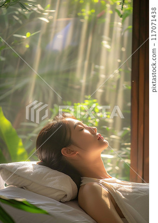 Beautiful woman relaxed face Thai massage sunlight streaming in modern spa Beautiful woman relaxed face Thai massage sunlight streaming in modern spa 117071438