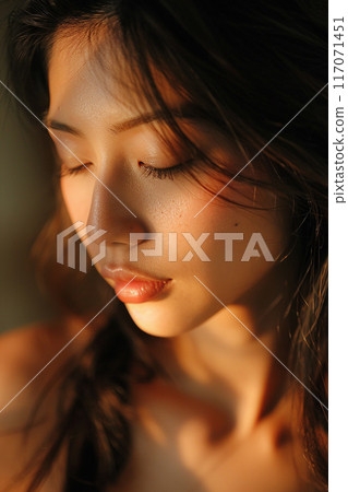 Beautiful woman's face relaxed expression Thai massage natural light magazine style Beautiful woman's face relaxed expression Thai massage natural light magazine style 117071451