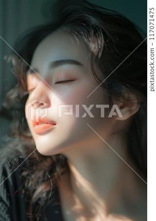 Elegant woman's relaxed face Thai massage soft natural light modern spa Elegant woman's relaxed face Thai massage soft natural light modern spa 117071475