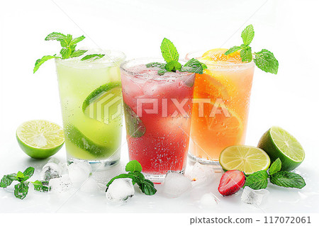 Refreshing summer juices on white background, garnished with mint leaves 117072061