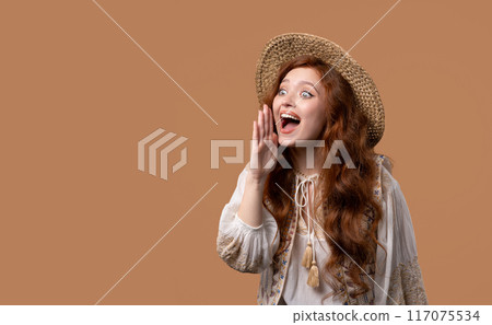 Attention, portrait of young woman shouting, holding hand near open mouth isolated on beige background with copy space for your advertisement. Attention, portrait of young woman shouting, holding hand near open mouth isolated on beige background with copy space for your advertisement. 117075534