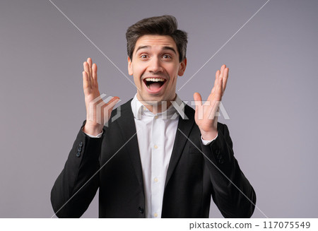Mature handsome shocked businessman glad, screaming WOW. Impressed boss leader office man, attention. Concept of great news profitable offer. Excited happy ceo on grey background. 117075549