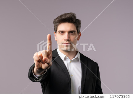 Serious american 30s businessman showing rejecting gesture by stop finger sign. Serious american 30s businessman showing rejecting gesture by stop finger sign. 117075565