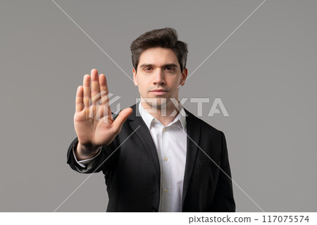 Serious mature businessman, rejecting gesture stop hand sign. Not Allow, restrict Serious mature businessman, rejecting gesture stop hand sign. Not Allow, restrict 117075574