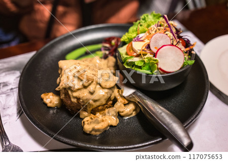 Grilled beef steak with truffle sauce and vegetable Grilled beef steak with truffle sauce and vegetable 117075653