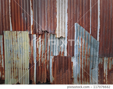 Old rust zinc sheet wall for textured background Old rust zinc sheet wall for textured background 117076682