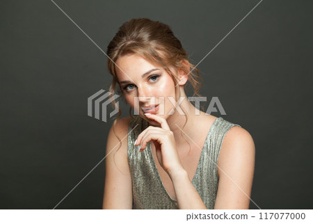 Nice good-looking woman with updo hairstyle and makeup. Young female model portrait Nice good-looking woman with updo hairstyle and makeup. Young female model portrait 117077000