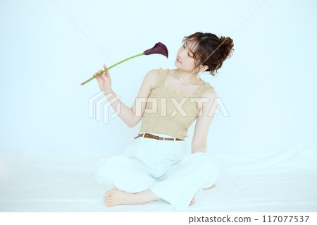 Portrait of woman with flowers Portrait of woman with flowers 117077537