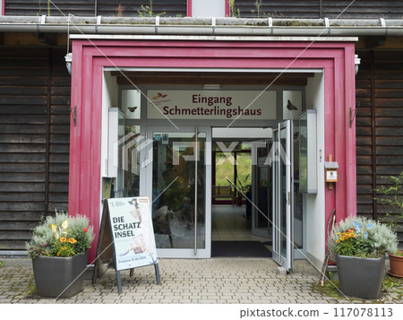 Jonsdorf, Germany, July 16, 2024: Jonsdorf Butterfly house entrance located close to czech borders with small aquaruim garden and terrarium Jonsdorf, Germany, July 16, 2024: Jonsdorf Butterfly house entrance located close to czech borders with small aquaruim garden and terrarium 117078113