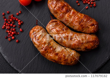 Grilled pork or chicken sausages with salt, spices and herbs 117079182