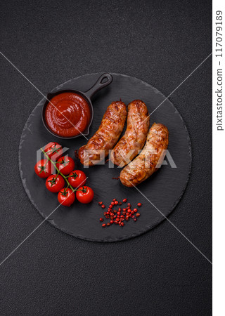 Grilled pork or chicken sausages with salt, spices and herbs 117079189