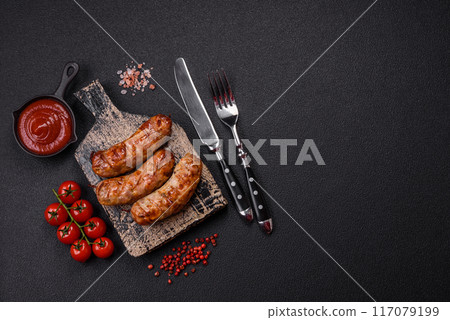 Grilled pork or chicken sausages with salt, spices and herbs Grilled pork or chicken sausages with salt, spices and herbs 117079199