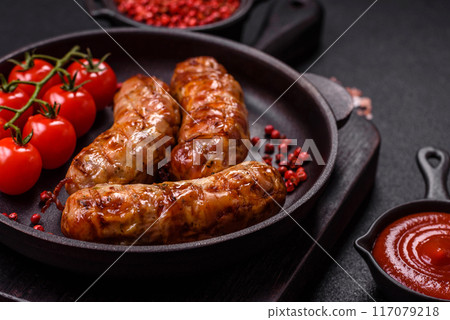 Grilled pork or chicken sausages with salt, spices and herbs Grilled pork or chicken sausages with salt, spices and herbs 117079218