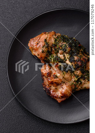 Grilled boneless chicken thigh with salt, spices and herbs 117079246