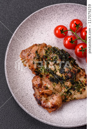 Grilled boneless chicken thigh with salt, spices and herbs 117079259
