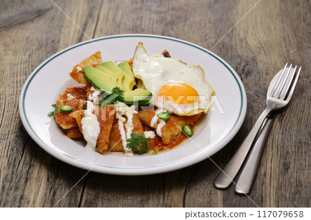 Chilaquiles, salsa roja, mexican breakfast Chilaquiles, salsa roja, mexican breakfast 117079658