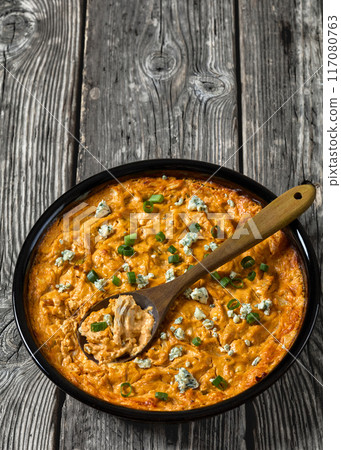 hot buffalo chicken dip in baking dish, top view hot buffalo chicken dip in baking dish, top view 117080763