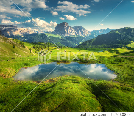Aerial view of little alpine lake in mountains at sunset. Summer Aerial view of little alpine lake in mountains at sunset. Summer 117080864