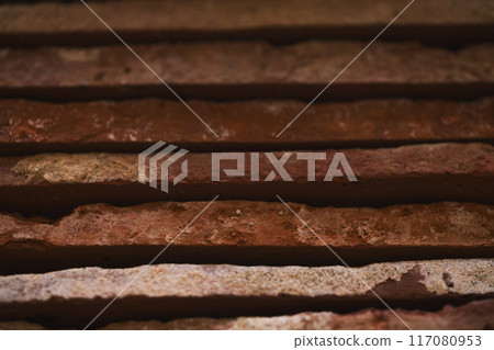 closeup stacked old brick cut tiles closeup stacked old brick cut tiles 117080953