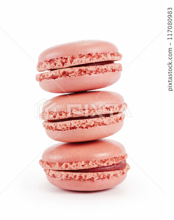 three pink macarons isolated on white 117080983
