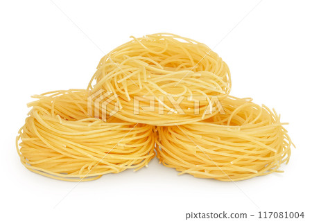 Italian pasta tagliatelle nest isolated on white background with full depth of field. Italian pasta tagliatelle nest isolated on white background with full depth of field. 117081004