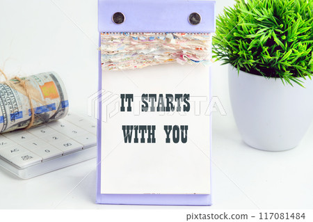 Conceptual it starts with you symbol. Copy space. It starts with you words written a conceptual phrase on a desktop tear-off calendar Conceptual it starts with you symbol. Copy space. It starts with you words written a conceptual phrase on a desktop tear-off calendar 117081484