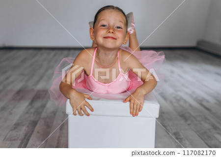 Baby ballet studio. Little ballerina with a coach in dance class. Ballet trainer for children Baby ballet studio. Little ballerina with a coach in dance class. Ballet trainer for children 117082170