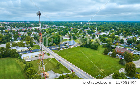 Muncie, Indiana radio tower with neighborhood and wide view of city aerial Muncie, Indiana radio tower with neighborhood and wide view of city aerial 117082404