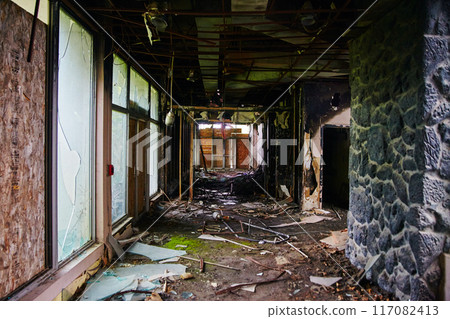 Desolate Abandoned Hotel Hallway with Debris and Decay, Eye-Level View 117082413