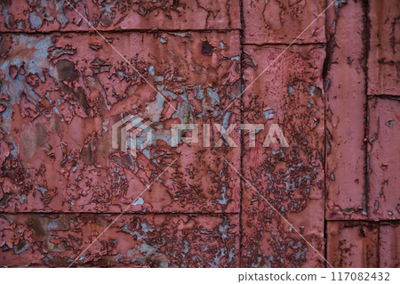Weathered Red Metal Panel with Peeling Paint and Rust Details Background Asset Weathered Red Metal Panel with Peeling Paint and Rust Details Background Asset 117082432