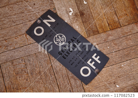 Vintage Electrical ON OFF Nameplate on Wooden Texture Vintage Electrical ON OFF Nameplate on Wooden Texture 117082523