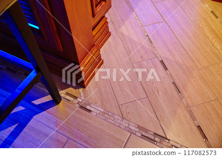 Modern Interior Design with Wooden and Tiled Floor Transition 117082573