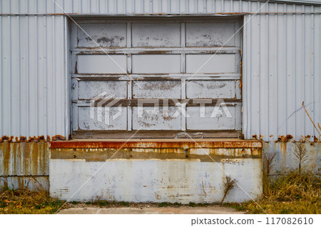 Rustic Weathered Garage Door on Aged Industrial Metal Wall in Warsaw, Indiana 117082610