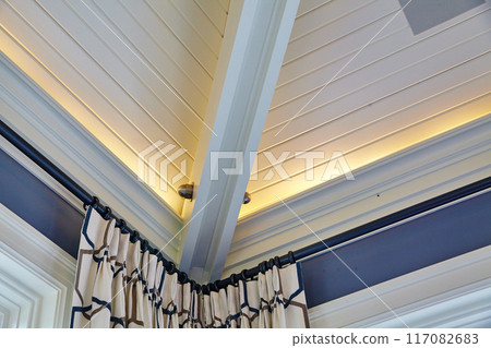 Elegant Interior Ceiling Detail with Geometric Curtain Design Elegant Interior Ceiling Detail with Geometric Curtain Design 117082683